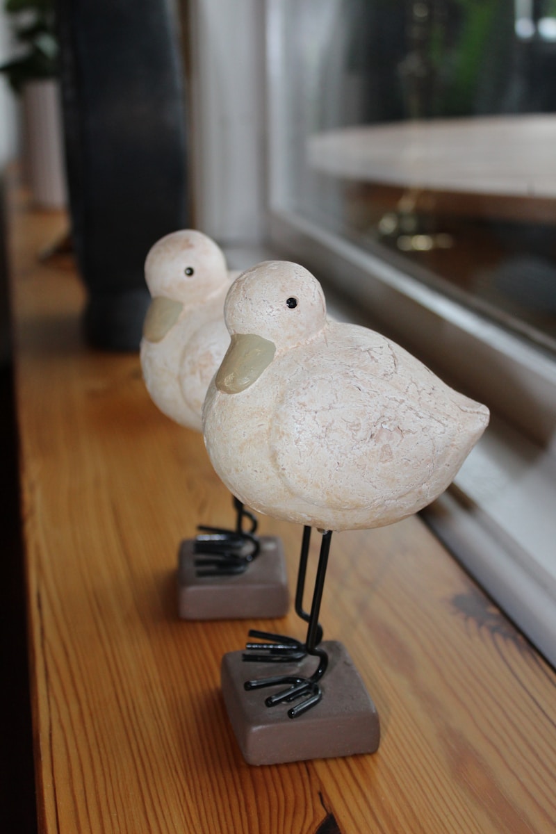 two white bird figurines